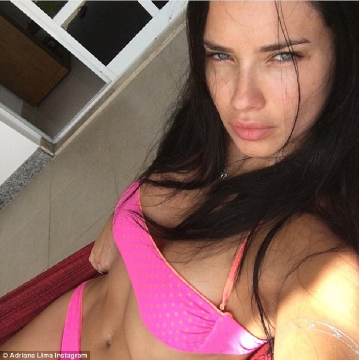 Adriana Lima smolders as she goes Makeup free in a tiny polka dot Bikini on vacation with family in Brazil