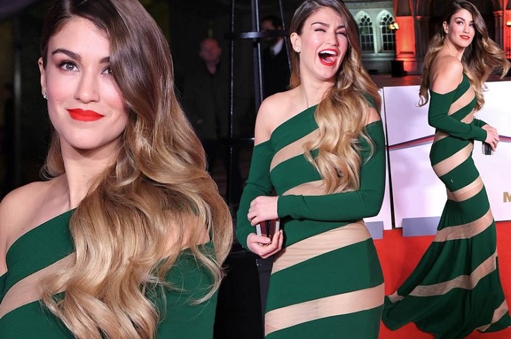 Helter-skelter or Christmas tree? Amy Willerton suffers wardrobe malfunction as she SPLITS gown at Sun’s Millies