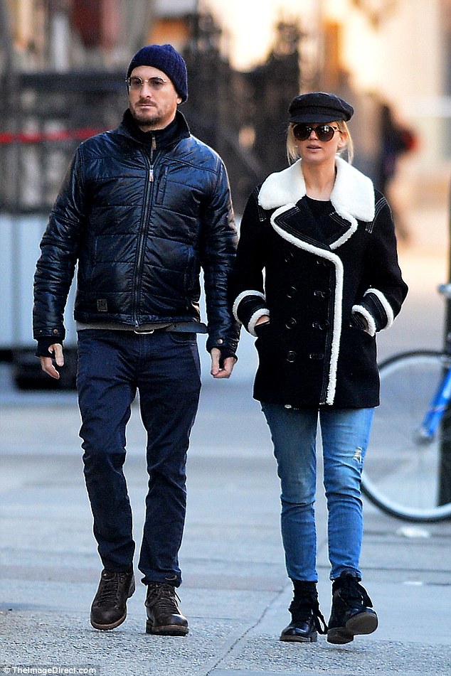 Jennifer Lawrence and Darren Aronofsky go public with their romance as they bundle up for stroll in NYC