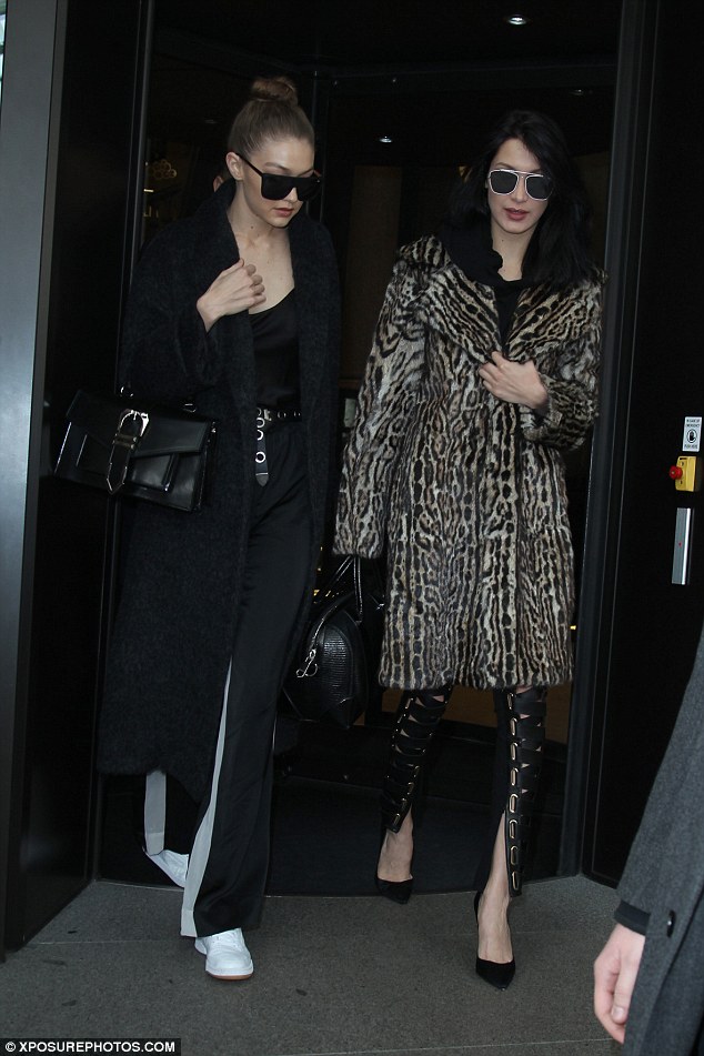 Bella and Gigi Hadid rock chic winter looks as they emerge from their hotel for the first day of Milan Fashion Week