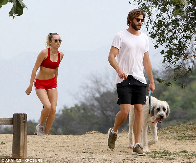 Miley Cyrus sizzles in crimson crop top and barely there shorts for hike with Liam Hemsworth