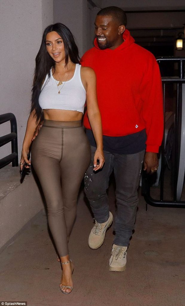 Not your average movie attire! Kim Kardashian shows off in interesting outfit as she takes a smiling Kanye to Planet Of The Apes