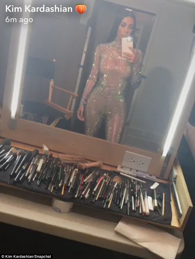 Kim Kardashian stuns in skintight glittering bodysuit as she shares racy snaps from secret shoot amid racism controversy