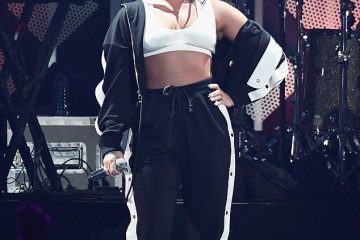 Demi Lovato bares her belly in bra-top and tracksuit for Atlanta’s Jingle Ball