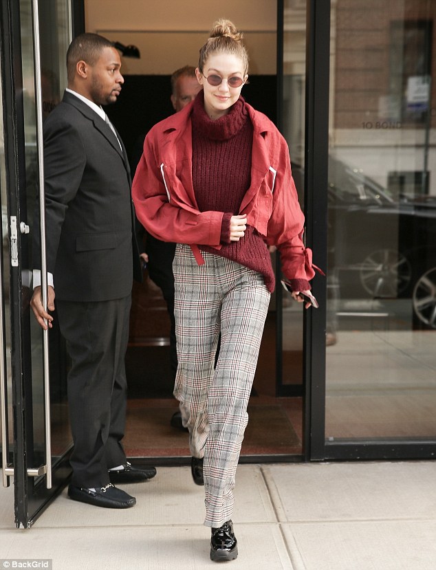 Gigi Hadid grins as she dons crimson jacket and sweater while seen for the first time since shock split with Zayn Malik