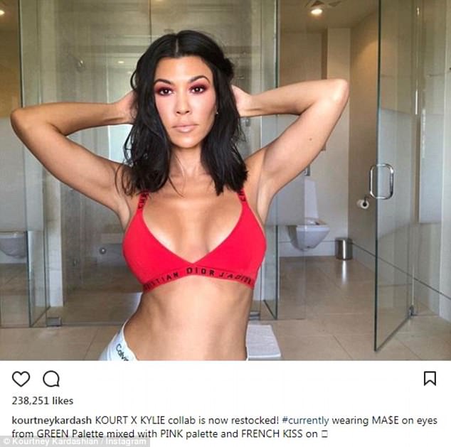 Kourtney Kardashian smolders as she showcases toned torso and cleavage in sexy red bra