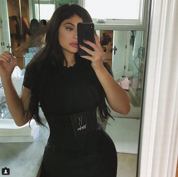 Kylie Jenner reclaims crown as selfie queen as she flashes bare stomach and curvy bum 7 weeks after giving birth