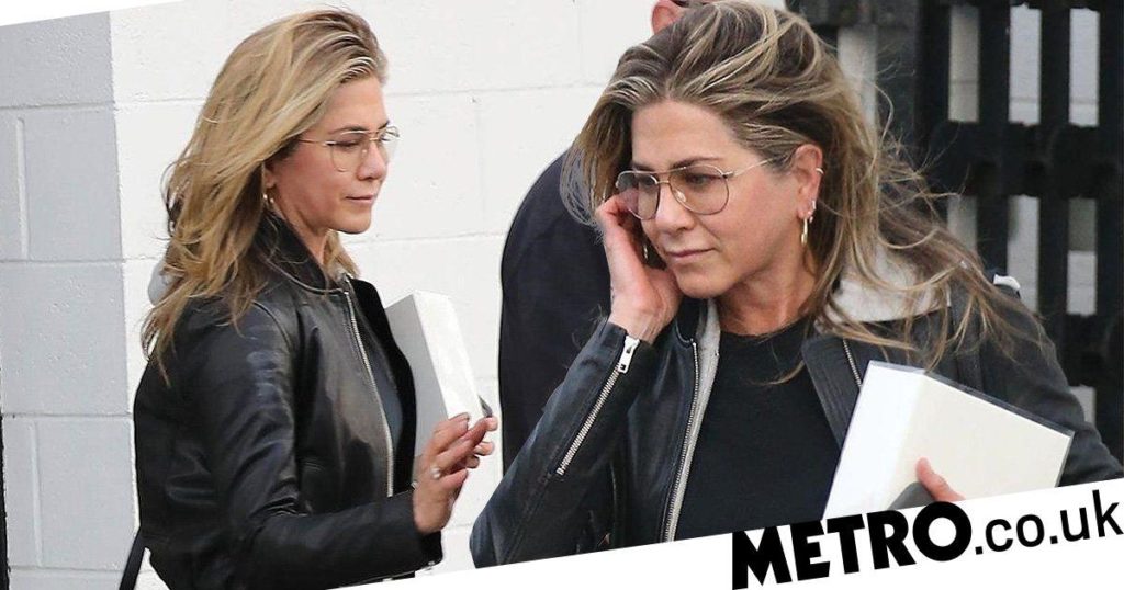 Jennifer Aniston takes security to hairdressers and looks far from crushed over Brad Pitt rumours