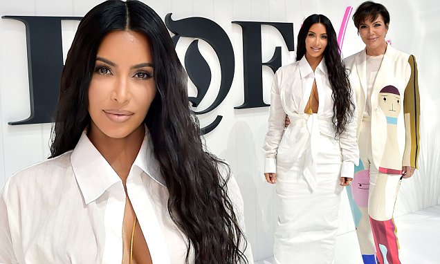 Kim Kardashian is white hot in VERY revealing blouse as she attends Fashion Summit with Kris Jenner