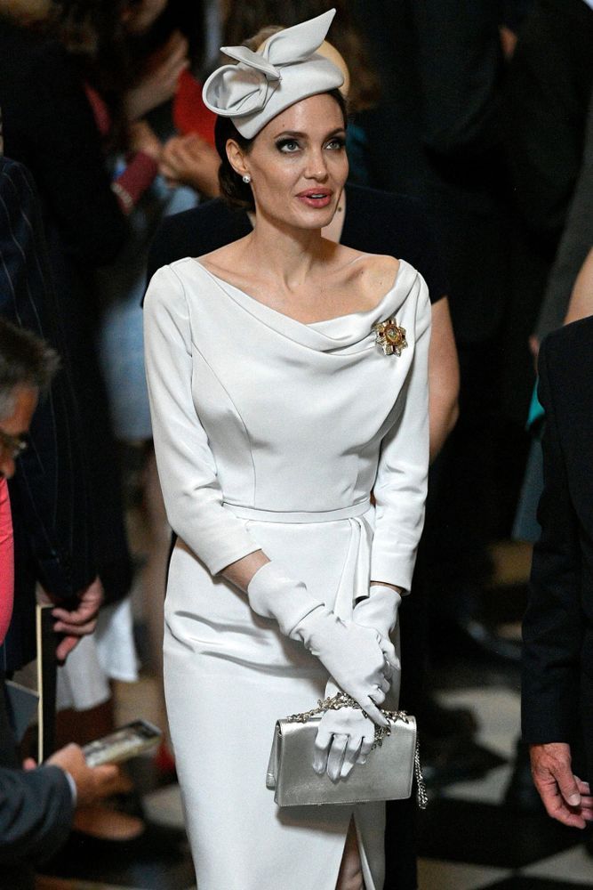 Angelina Jolie takes a Cue from Meghan Markle in Fascinator, Off-the-Shoulder Dress for Royal Event