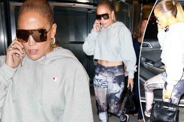 Jennifer Lopez flaunts her toned abs in patterned leggings and cropped sweater while out in NYC