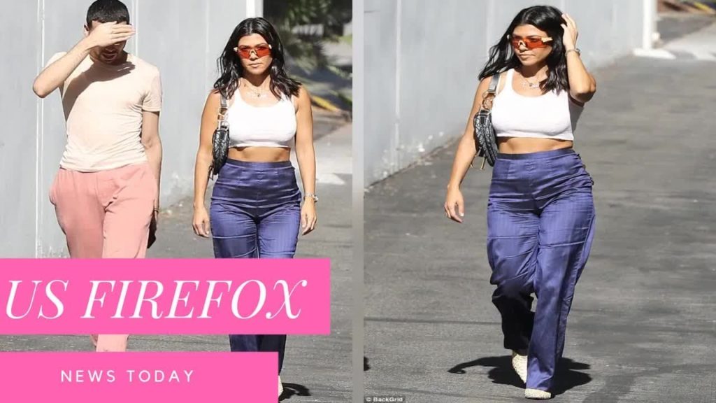 Kourtney Kardashian shows off her sculpted midriff in blue and white after cheering on LA Dodgers