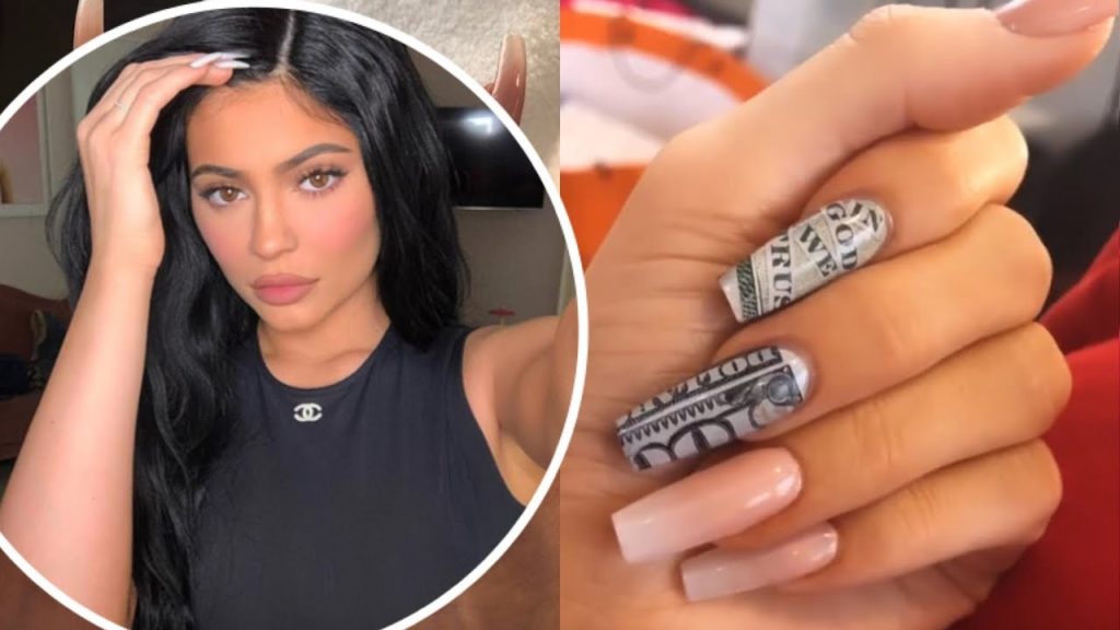 Kylie Jenner nails the billionaire look by getting 0 bills painted on her fingers